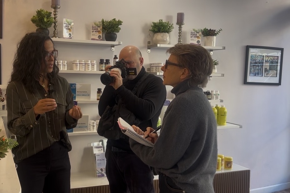 Indhira being interviewed and photographed